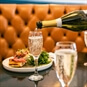 i360 & Bottomless Brunch for Two Brighton - Pouring a glass of bubbles